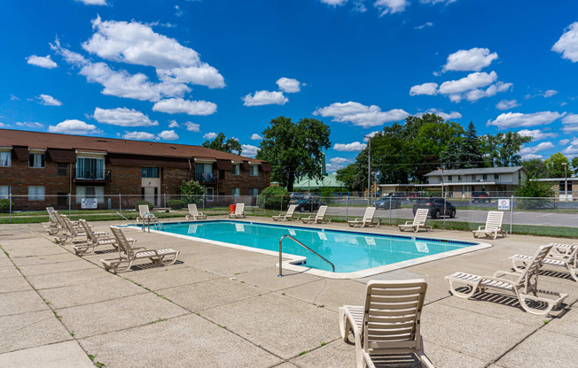 Swimming Pool and pool chairs at Warren Woods Apartments in Warren. Michigan