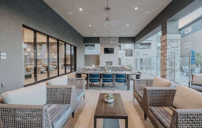 Large patio with plenty of seating, fireplace, fans, and perfect view of the pool.