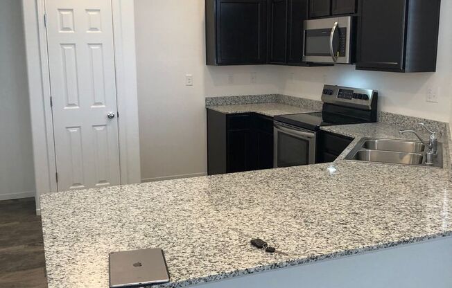 $2395.00 - NEW FLOORING UPSTAIRS - STAINLESS - GRANITE - NO YARD TO MAINTAIN