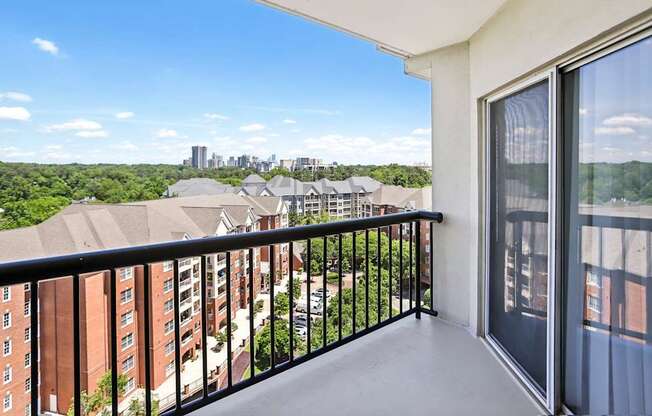 A balcony with a view of a city skyline.