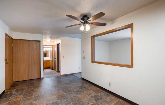 a dining room with a ceiling fan. Fargo, ND Southview Village Apartments