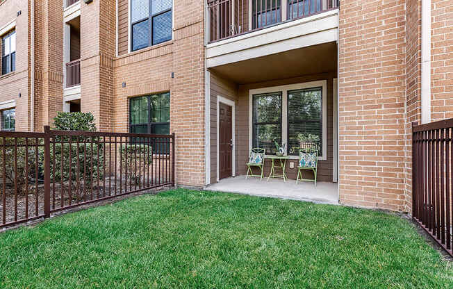 our apartments offer a patio with chairs and a lawn