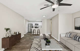 Model Living Room with Wood-Style Flooring and View of Kitchen at Element 41 Apartments located in Marietta, GA.