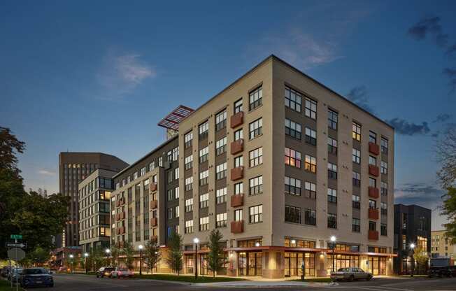 a large building on a city street at night at The Lucy Boise Apartments, Boise, 83702