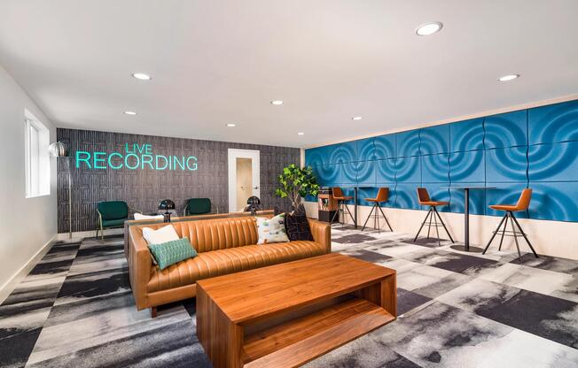 The coworking lounge features collaborative gathering areas, individual workstations, and comfortable seating designed to support productivity, studying, and remote work.