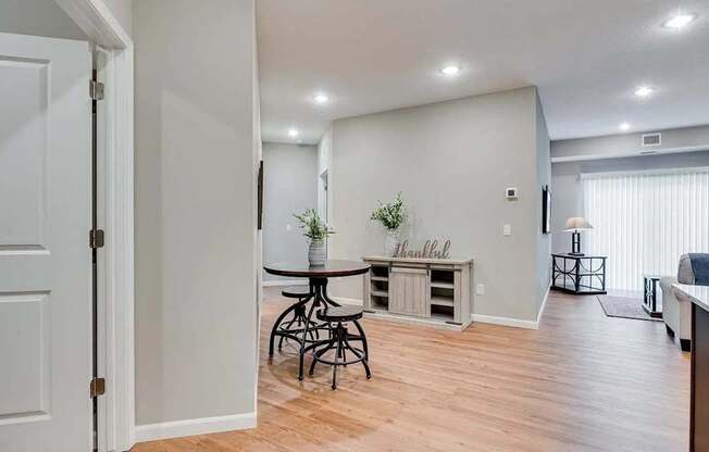 an open living room with a dining room and a kitchen.  Circle Pines, MN Lexington Lofts