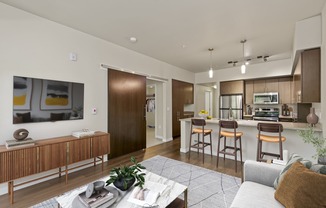 a kitchen and living room in a 555 waverly unit