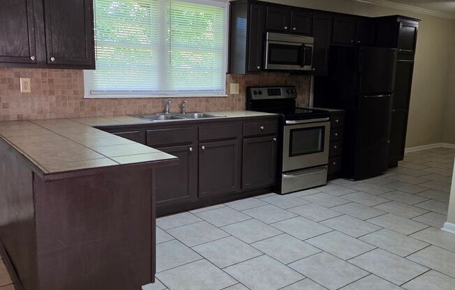 Lovely 3 Bedroom Home with Large Fenced in Yard!