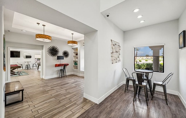 Community Clubhouse with Game Tables and Lounge Furniture at Stonegate Apartments located in Las Vegas, NV.