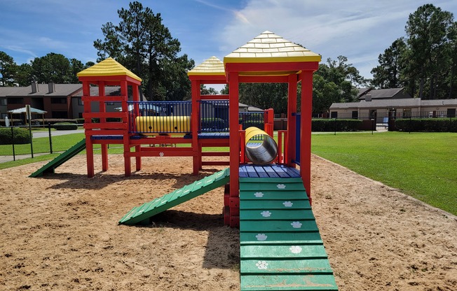 a playground with a slide and a basketball on it