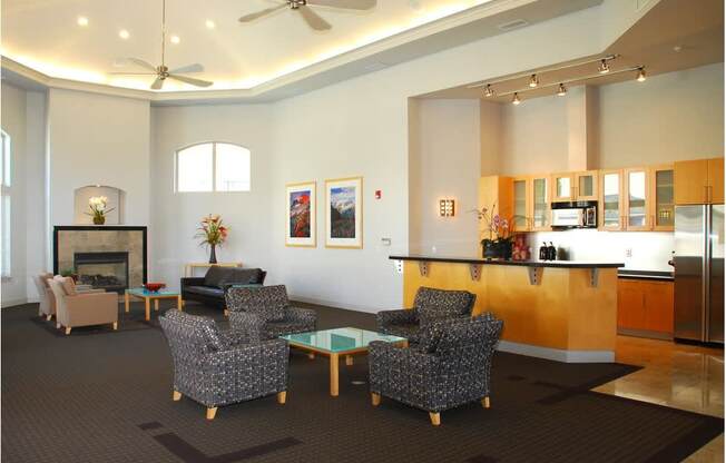 A living room with a fireplace and a dining table at Wilsonville Summit Apartments, Wilsonville , OR, 97070