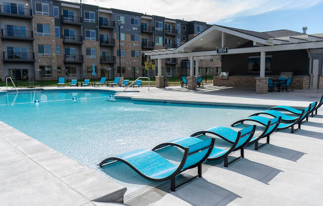 Pool with Lounge Chairs at Sterling Prairie Trail North in Ankeny, IA