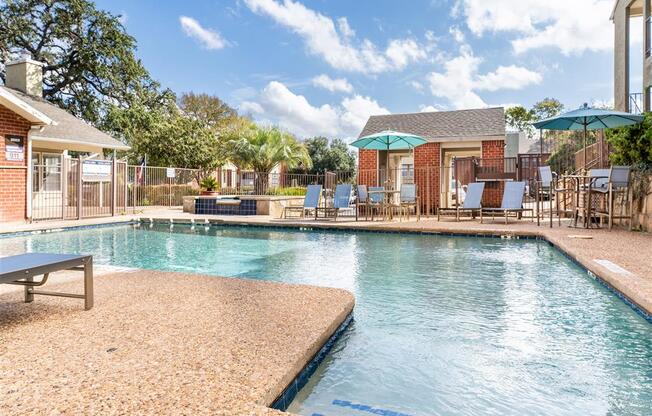 Refreshing Pool With Large Sundeck And Wi-Fi at Wildwood Apartments, CLEAR Property Management, Austin, Texas