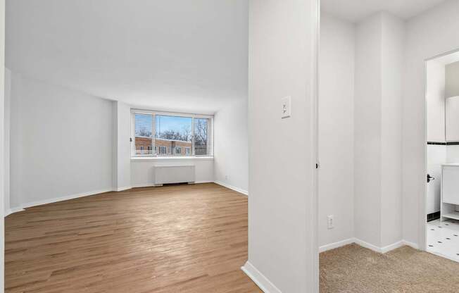A room with wooden floors and white walls.