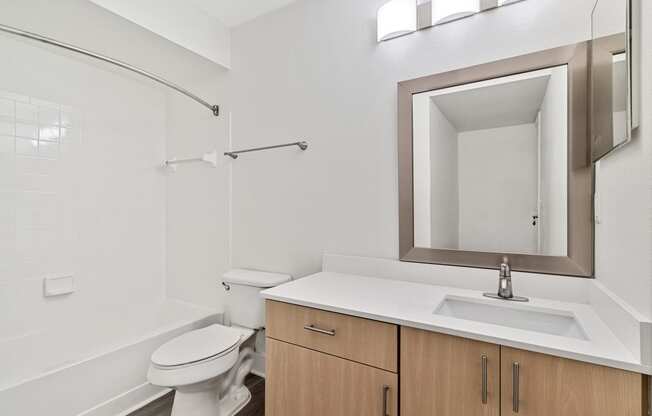 renovated bathroom with quartz countertops
