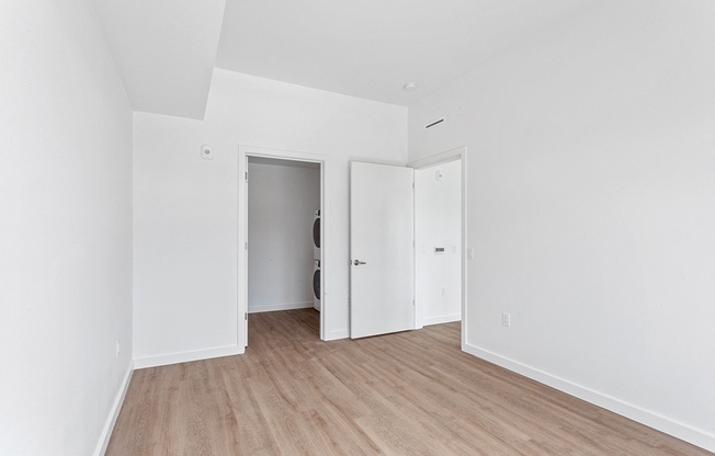 a room with white walls and a wooden floor