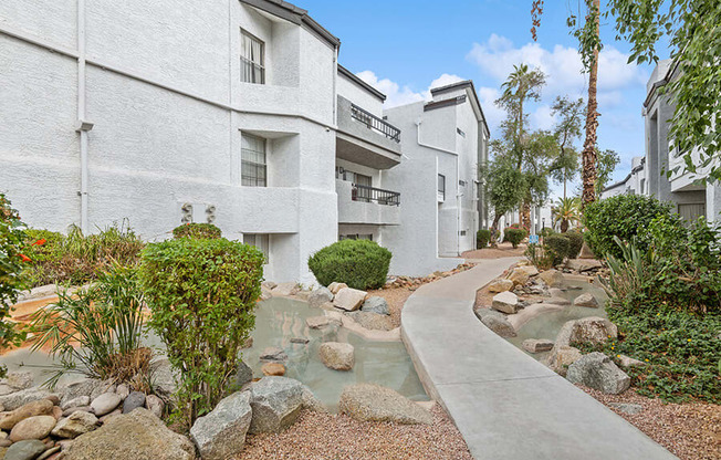 Exterior Community Building and Landscape at Crystal Creek Apartments in Phoenix, AZ.