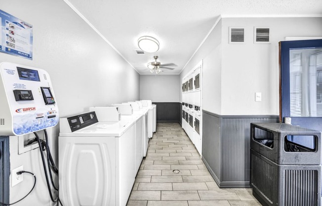 a laundry room with a bunch of machines in it