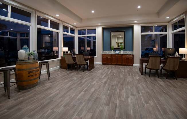 A room with wooden floors and furniture.