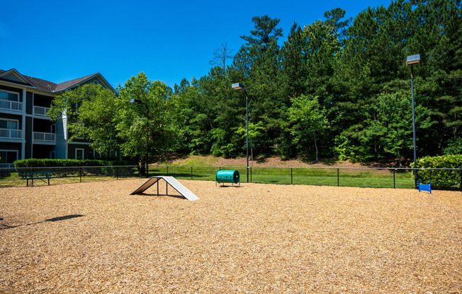 a park with a skateboard ramp in front of a building