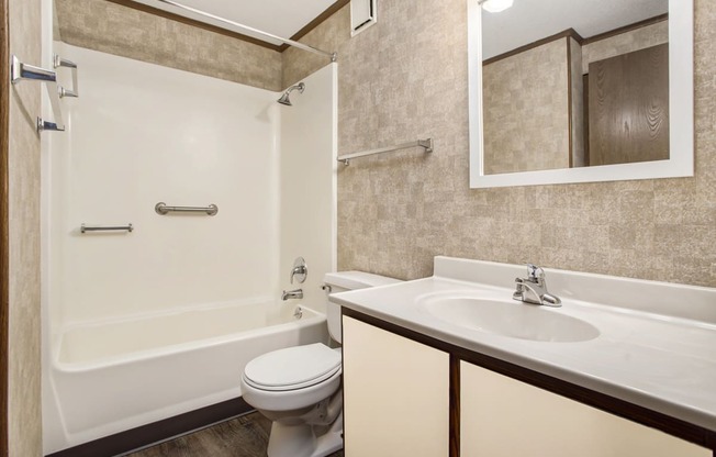 a bathroom with a sink toilet and bathtub