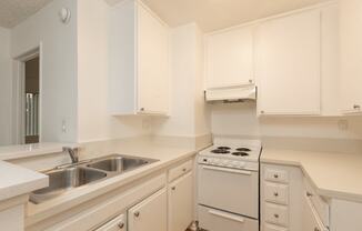 Kitchen with White Appliances and White Cabinets