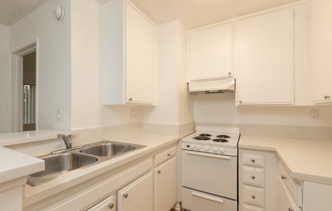 Kitchen with White Appliances and White Cabinets