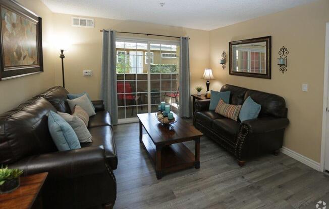 Spacious Living Room With Private Balcony at Citrus Gardens Apartments, Fontana, CA 92335