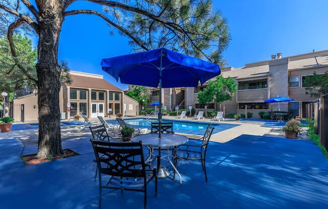 Sunchase community pool with a blue umbrella