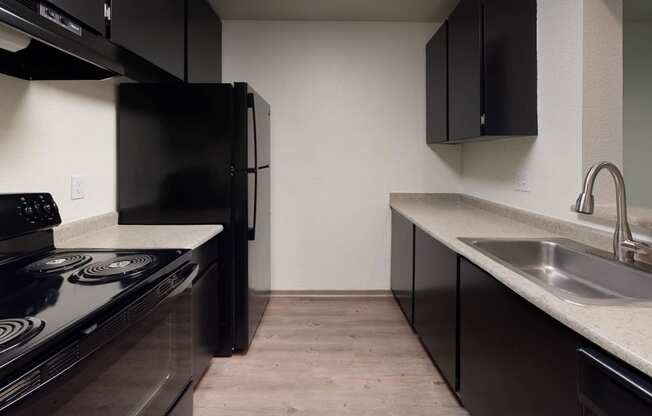 Kitchen with appliances at North Creek Apartments, Everett