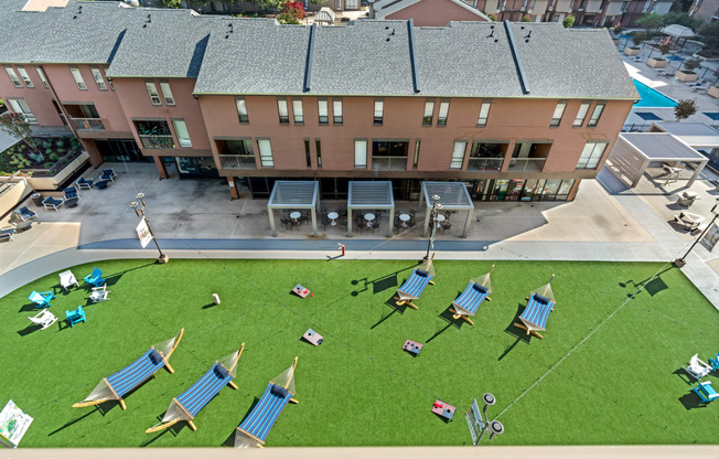 an aerial view of the courtyard with lounge chairs and umbrellas
