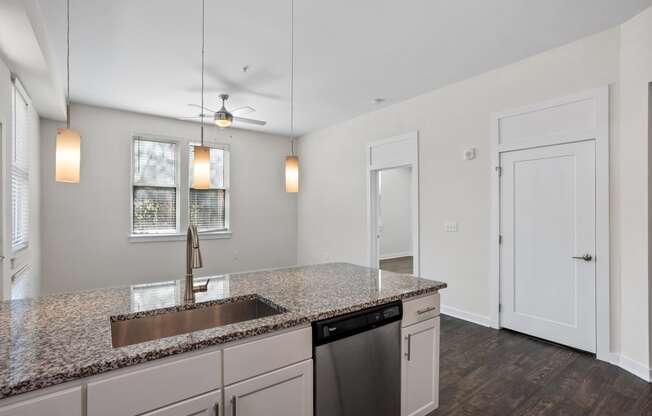 a kitchen with a sink and a counter top