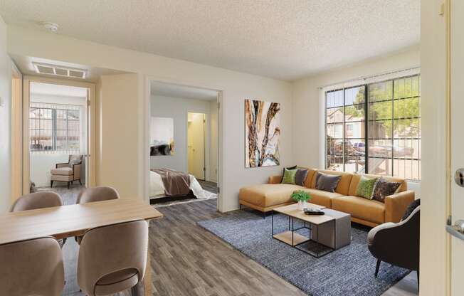 an open living room and dining room with a couch and a table