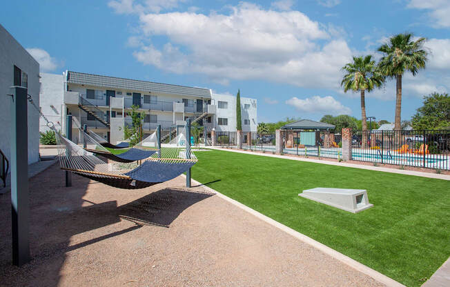 Hammock Lounge Area and Cornhole Playing Area at The Link at 4th Ave Apartments