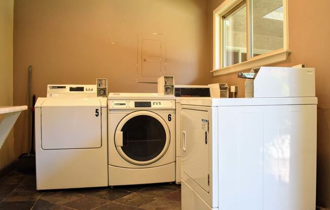 community laundry room with washers and dryers