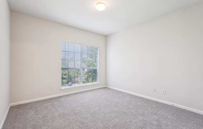 A big bedroom with a window