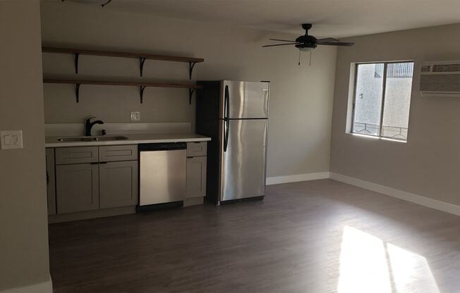 Kitchen Area With Ceiling Fan, Hardwood Flooring, Stainless Steel Appliances at Wilson Apartments in Glendale, CA