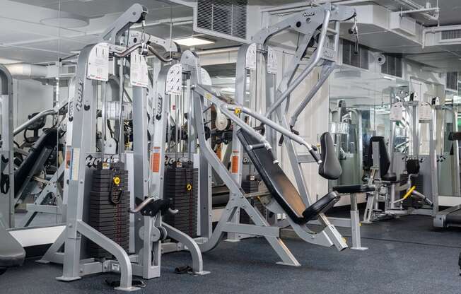 a variety of weight machines in a gym