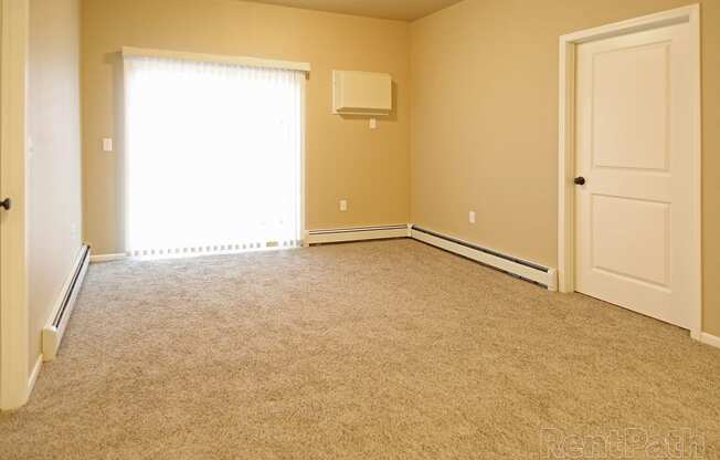 living room, patio door at Cascades of Mandan, Mandan, ND, 58554