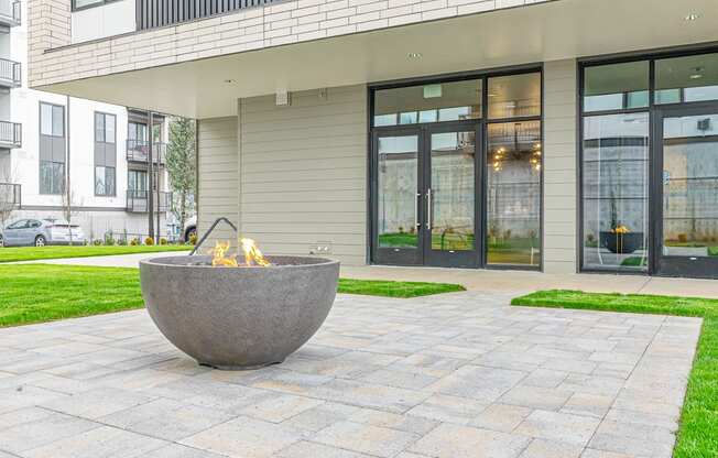 a fire pit in front of a building
