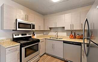 A newly renovated kitchen with stainless steel appliances at Heritage Hill Estates Apartments, Cincinnati, Ohio 45227