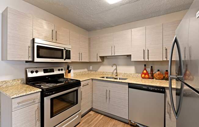 A newly renovated kitchen with stainless steel appliances at Heritage Hill Estates Apartments, Cincinnati, Ohio 45227