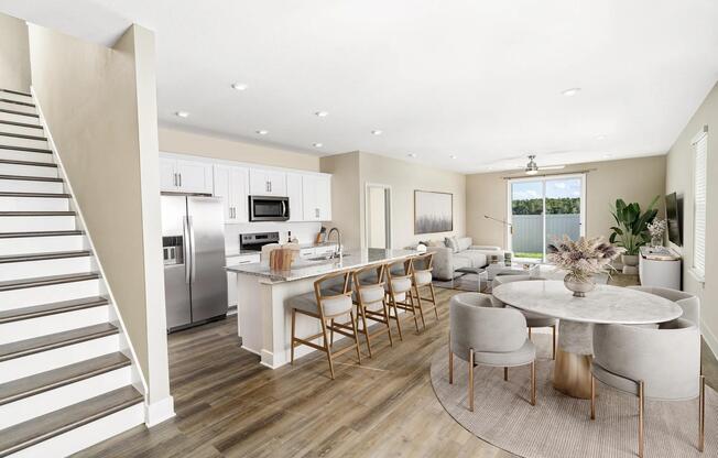 An airy, open first floor at Amavi Kissimmee offers plenty of room to gather, with easy access to nearby parks, shopping, and everyday conveniences.