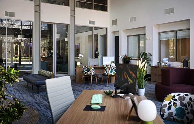 a living room filled with furniture and a large window