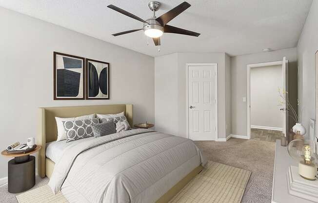 Model Bedroom with Carpet and Hallway View at Retreat at Stonecrest Apartments located in Lithonia, GA.