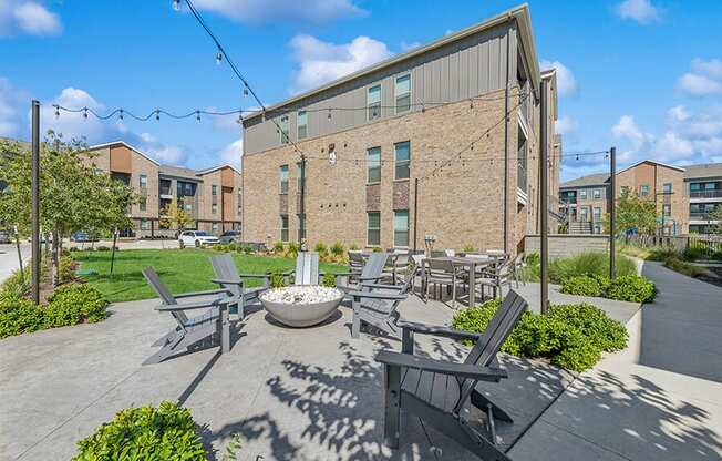 Outdoor Fire Pit Area and Lounge Furniture at Alta 3Eighty Apartments located in Aubrey, TX.