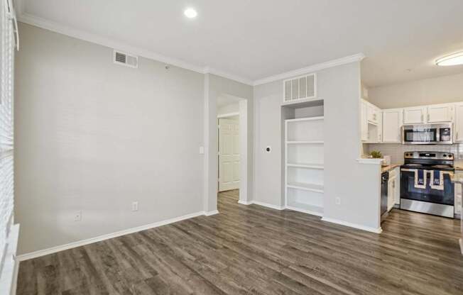A kitchen with a stove top oven and a microwave.