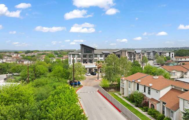 A view of a residential area with houses and a road.