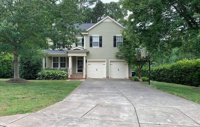 NW RALEIGH TWO STORY BRICK HOME IN ESTABLISHED NEIGHBORHOOD WITH TWO CAR GARAGE