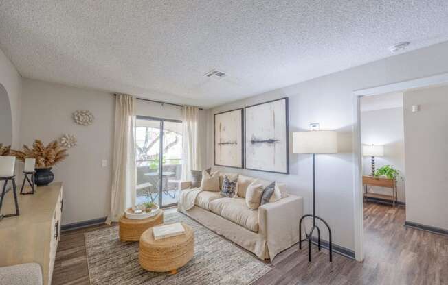 a living room with a couch and a window